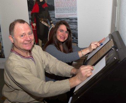 Manx Museum Site Manager Alan Kinvig shows Isle of Man Steam Packet Company Marketing and Online Manager Renee Caley around the Heroes exhibition