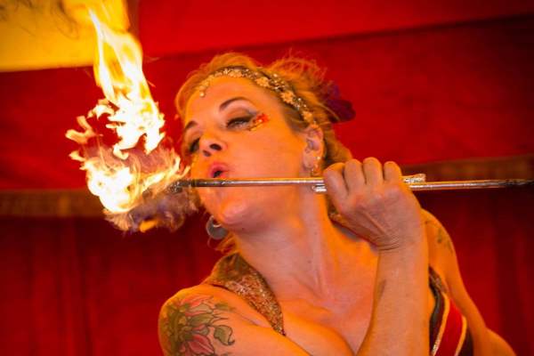 This is an image of a lady breathing fire at the circus at Milntown estate Isle of Man 