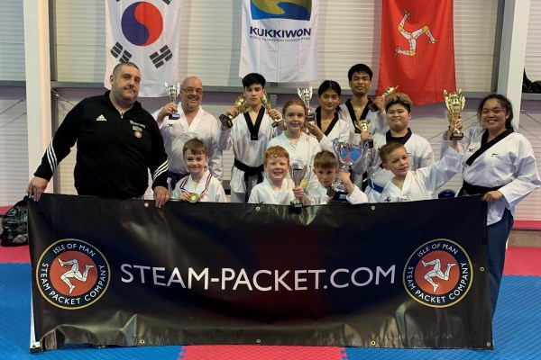 Flying Phoenix Taekwondo Senior Instructor Christopher Guzman (front left) with his students