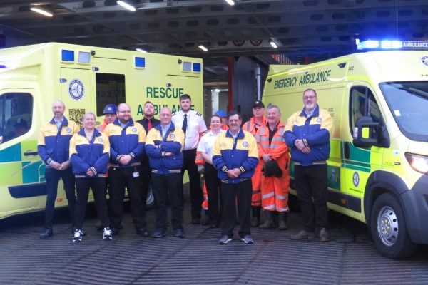 Hogg Motorsport crew with Steam Packet Company staff as they boarded the Ben-my-Chree for the Rally of Mull, alongside the new rescue ambulance (left) and emergency unit