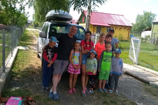 Chris and some of the children who live in the houses that Hands of Hope built in the village of Cobila.